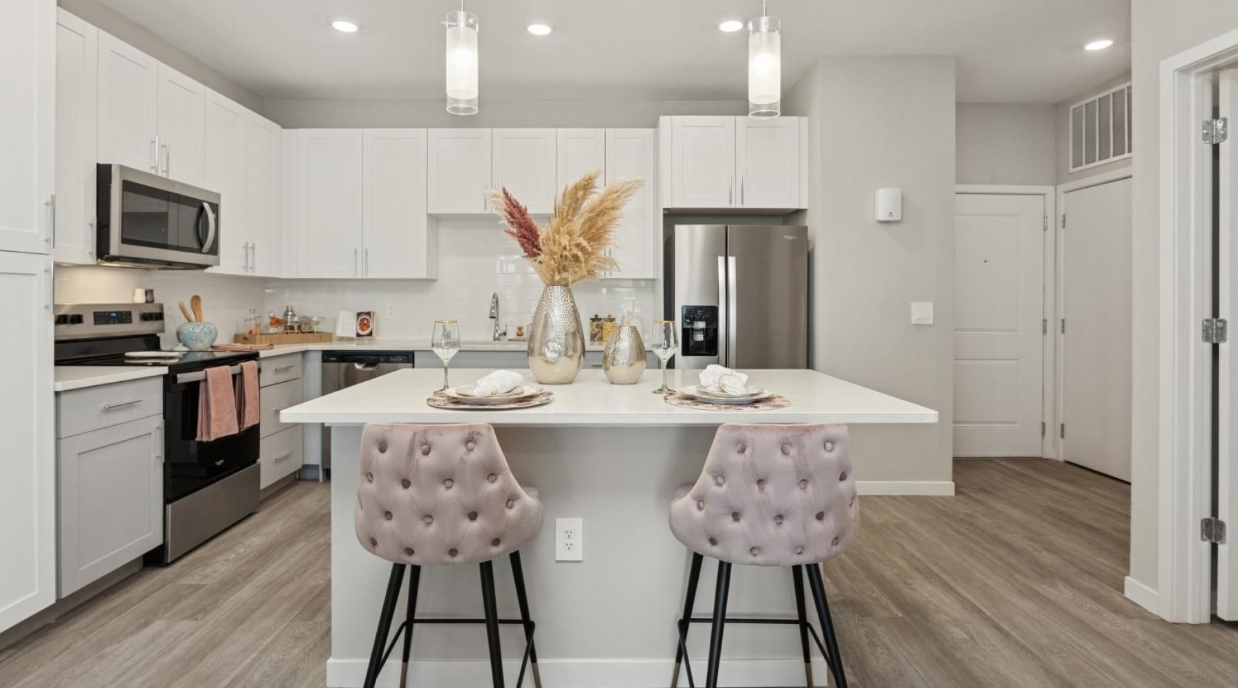 a kitchen with white cabinets
